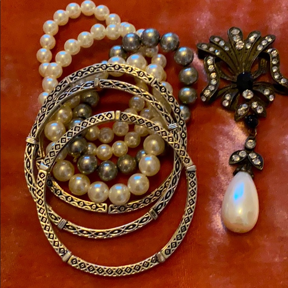 Already bundled! Stretch bracelets and broach.